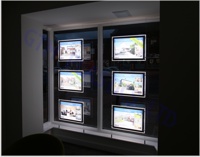 A3 LED pockets in a letting agent's window - looking left from inside the room
