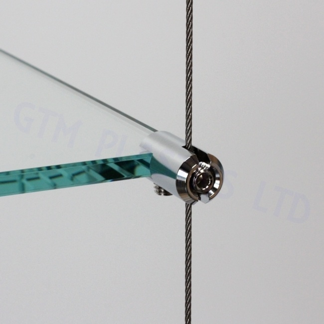 Close up view of a chrome plated cable-to-shelf-clamp supporting a glass shelf panel