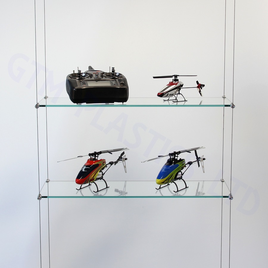 Glass wire suspended shelving being used to display model helicopters